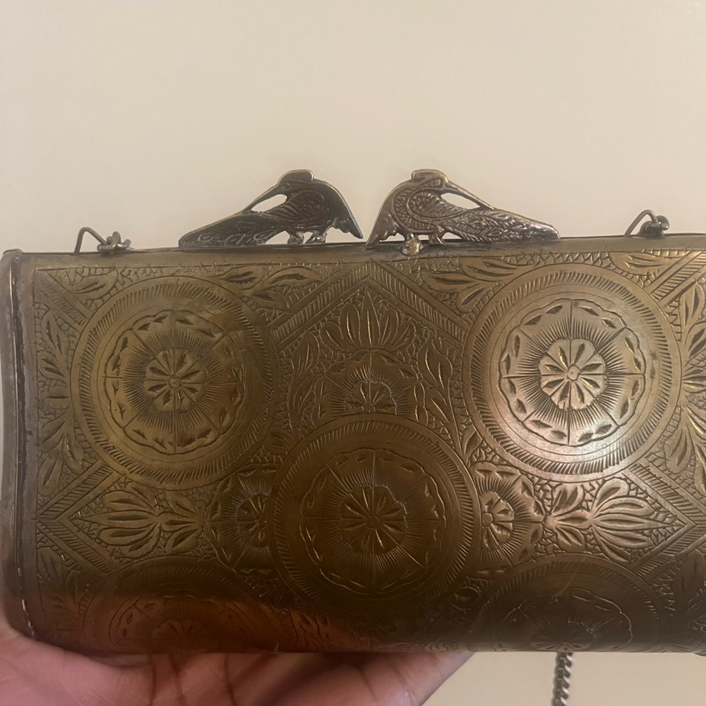 Vintage gold metal imprint clutch